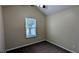 Clean bedroom with neutral walls, carpet, a ceiling fan, and a window at 7518 Edenberry Way, Lithonia, GA 30058