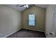 Cozy bedroom with neutral walls, carpet, ceiling fan, and vaulted ceiling at 7518 Edenberry Way, Lithonia, GA 30058