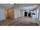 The living room area offers an open floor plan that flows into the kitchen with great views at 7518 Edenberry Way, Lithonia, GA 30058