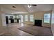 A combined open floorplan, living room and kitchen area create a welcoming atmosphere with natural light at 7518 Edenberry Way, Lithonia, GA 30058
