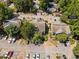 Overhead shot of the condo complex with ample parking and mature trees at 1106 Rock Creek Ln at 1106 Rock Creek Ln, Norcross, GA 30093