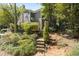 Back exterior of home with stairs leading up to the entrance at 1106 Rock Creek Ln, Norcross, GA 30093