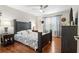 Bedroom with hardwood floors, ceiling fan and a nicely decorated bed at 1106 Rock Creek Ln, Norcross, GA 30093