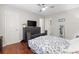 Bedroom features a ceiling fan, hardwood floors and a large window at 1106 Rock Creek Ln, Norcross, GA 30093