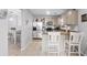 Eat-in kitchen with stainless steel appliances, breakfast bar seating, and bright lighting fixtures at 1106 Rock Creek Ln, Norcross, GA 30093