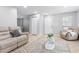 Bright living room with tile floors, neutral walls, comfortable seating, and a fireplace at 1106 Rock Creek Ln, Norcross, GA 30093