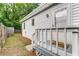 Side view of a white house with fenced-in yard and wooden deck at 1596 Foote Ne St, Atlanta, GA 30307