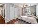 Charming bedroom featuring a comfortable bed, modern ceiling fan, and ample closet space at 1596 Foote Ne St, Atlanta, GA 30307