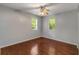 Bright bedroom with hardwood floors, a ceiling fan, and large windows at 1596 Foote Ne St, Atlanta, GA 30307