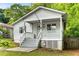 Adorable home featuring a covered front porch, neat landscaping, and a welcoming facade at 1596 Foote Ne St, Atlanta, GA 30307