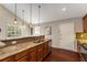 Well-appointed kitchen with granite counters, stainless appliances, tiled backsplash, and wood floors at 1596 Foote Ne St, Atlanta, GA 30307