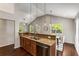 Open kitchen with granite counters, stainless appliances, tile backsplash, and views to the dining area at 1596 Foote Ne St, Atlanta, GA 30307