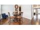 Cozy dining room featuring hardwood floors, elegant chairs, and an elegant pendant lamp above table at 2119 Dee Dee Muse Nw Ln, Atlanta, GA 30318