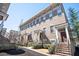 Brick townhomes feature individual entries, stoops, and landscaped frontages, creating curb appeal at 2119 Dee Dee Muse Nw Ln, Atlanta, GA 30318