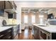 Modern kitchen featuring stainless steel appliances, dark cabinetry, and marble countertops at 2119 Dee Dee Muse Nw Ln, Atlanta, GA 30318