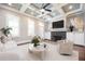 Bright living room with coffered ceiling, fireplace, white built-ins, and neutral furnishings at 2119 Dee Dee Muse Nw Ln, Atlanta, GA 30318