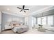 Bright main bedroom with seating area, large windows, and neutral decor at 2119 Dee Dee Muse Nw Ln, Atlanta, GA 30318