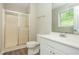 Clean bathroom with a shower, toilet, and sink with white vanity at 4855 Brownsville Rd, Powder Springs, GA 30127