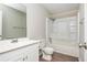 A bright bathroom features a white vanity, toilet, and a shower-tub combination at 4855 Brownsville Rd, Powder Springs, GA 30127