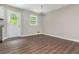 Bright eat-in kitchen features wood floors, neutral walls, and a back door leading to the outdoors at 4855 Brownsville Rd, Powder Springs, GA 30127