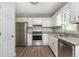 Updated kitchen featuring stainless steel appliances, and bright white cabinetry at 4855 Brownsville Rd, Powder Springs, GA 30127