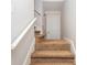Carpeted staircase with white railing leading to the upper level of the home at 4855 Brownsville Rd, Powder Springs, GA 30127