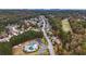 A vibrant neighborhood is shown from above, with mature trees and community recreation area at 570 Highcrest Dr, Acworth, GA 30101