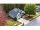 Aerial view of a lovely home, with a well-kept lawn and mature trees in the background at 570 Highcrest Dr, Acworth, GA 30101