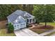 Aerial view of home with well-maintained lawn, mature trees, and two-car garage at 570 Highcrest Dr, Acworth, GA 30101
