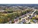 An aerial view showcases a home nestled within a serene, tree-filled neighborhood at 570 Highcrest Dr, Acworth, GA 30101