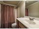Functional bathroom with a single sink, wooden vanity, and shower with neutral tones at 570 Highcrest Dr, Acworth, GA 30101