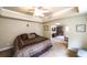 Bright bedroom with tray ceiling and entry to living room at 570 Highcrest Dr, Acworth, GA 30101