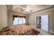 Spacious bedroom features a tray ceiling, ceiling fan and a large window allowing lots of natural light at 570 Highcrest Dr, Acworth, GA 30101