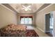 Spacious bedroom features a tray ceiling, ceiling fan and neutral paint at 570 Highcrest Dr, Acworth, GA 30101