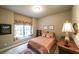 Peaceful bedroom with a window seat, neutral decor, and soft lighting at 570 Highcrest Dr, Acworth, GA 30101