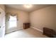 Comfortable bedroom with neutral walls, natural light, and classic wood furniture at 570 Highcrest Dr, Acworth, GA 30101