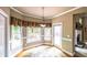 Sunlit breakfast nook with bay window and access to a deck at 570 Highcrest Dr, Acworth, GA 30101