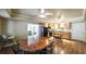 Dining area features a wood table with black chairs and is open to the kitchen at 570 Highcrest Dr, Acworth, GA 30101