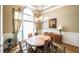 Elegant dining room featuring a large window, hardwood floors, and classic chandelier at 570 Highcrest Dr, Acworth, GA 30101