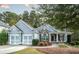 Charming one-story home featuring a two-car garage, stone accents, and inviting front porch at 570 Highcrest Dr, Acworth, GA 30101