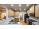 Well-lit kitchen featuring wooden cabinets, stainless steel appliances, and hardwood floors at 570 Highcrest Dr, Acworth, GA 30101