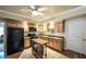 Modern kitchen with stainless steel appliances, wood cabinets and a breakfast bar at 570 Highcrest Dr, Acworth, GA 30101