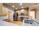 Modern kitchen featuring stainless steel appliances, wooden cabinets and granite countertops at 570 Highcrest Dr, Acworth, GA 30101