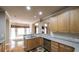 Open kitchen boasts granite countertops and an eat-in breakfast nook with hardwood floors at 570 Highcrest Dr, Acworth, GA 30101