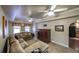 Comfortable living room featuring a large sectional sofa, ceiling fans, and access to kitchen at 570 Highcrest Dr, Acworth, GA 30101