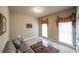 Cozy living room with neutral walls, large windows, and a comfortable seating area at 570 Highcrest Dr, Acworth, GA 30101