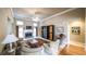 Open living room with fireplace, large windows, and views of the front yard at 570 Highcrest Dr, Acworth, GA 30101