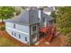 The rear exterior showcases the home's architectural design, outdoor stairs, and landscaped yard at 570 Highcrest Dr, Acworth, GA 30101