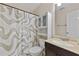 Bathroom with a toilet, shower with a patterned curtain and an overhead cabinet at 129 Lakepointe Ct, Stockbridge, GA 30281
