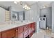 Bathroom with double sink vanity, marble countertop, ample storage and modern fixtures at 129 Lakepointe Ct, Stockbridge, GA 30281